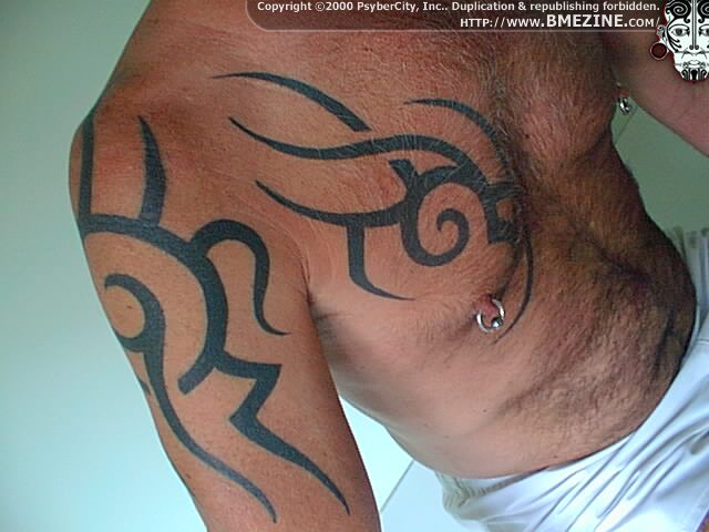 tribal tattoos on shoulder and chest. tribal tattoos for chest and