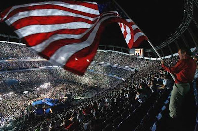 The flag flies at Mile High Stadium. 