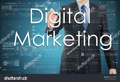 A man in dark suit writing Digital Marketing in virtual screen.