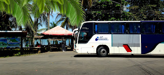 Mepe bus in front of bus stop in Puerto Viejo, Costa Rica