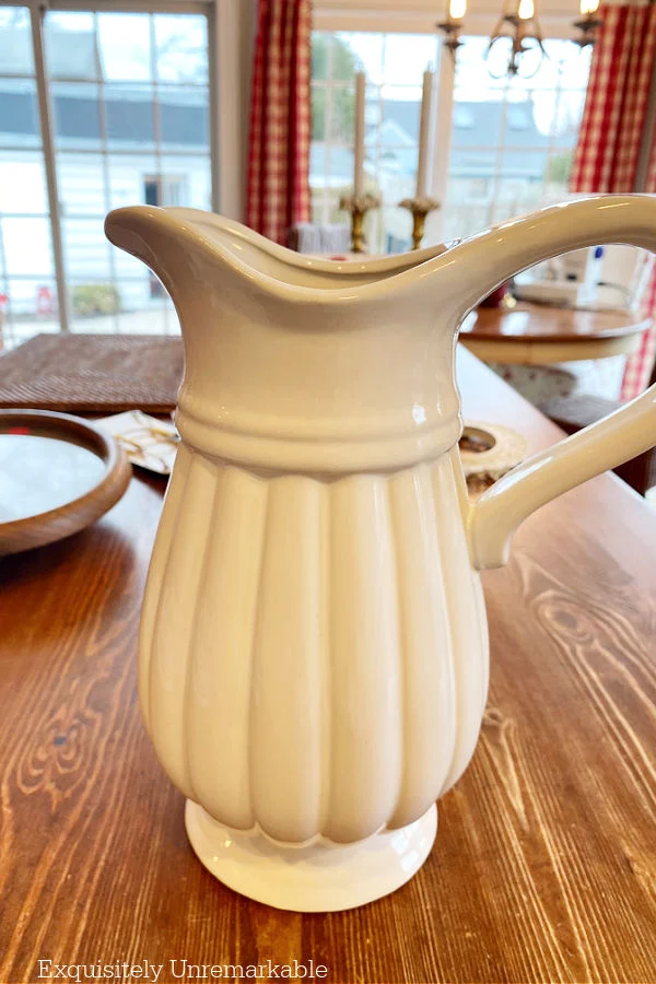 White Fluted Ceramic Pitcher on a table