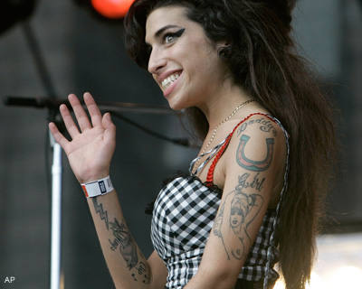 Amy Winehiuse tattoos are inspired from the old sailor tattoos anchor 