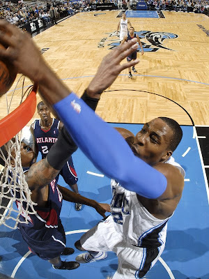 chris paul dunks over dwight howard. dwight howard dunks on.