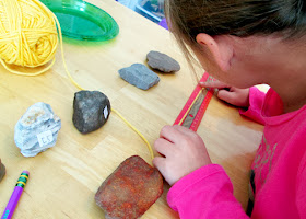 After arranging a selection of rocks by her perception of smallest to largest, Tessa measured the rocks and recorded their actual sizes. To do so, she wrapped pieces of yarn around their widest points, then measured the cut lengths. She was surprised to learn that her perception was drastically off in some cases.