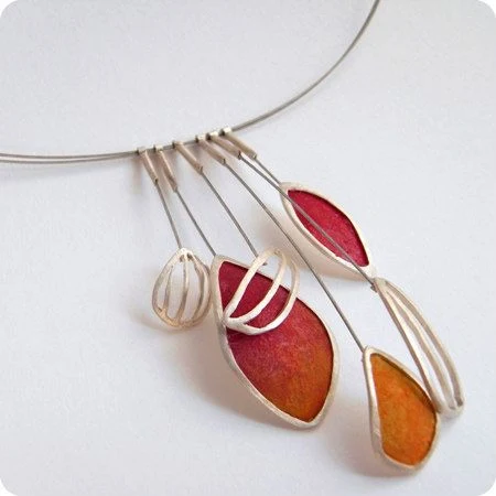 silver and hand painted modern paper necklace in shades of coral and orange