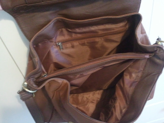 three compartments in brown handbag, middle one sipped