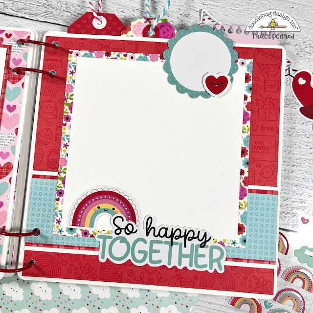 Valentine's Day Lots of Love scrapbook album page with a rainbow, flowers, and tags