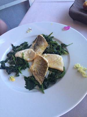 white fish (caught in Lake Garda), served with wild greens and wild flowers