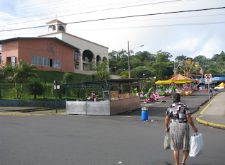 Woman walking near outdoor festival in Puriscal