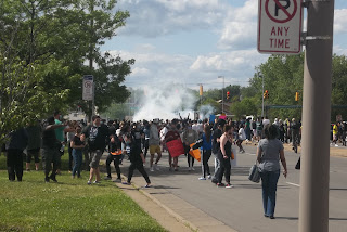 Marchers fleeing the scene.