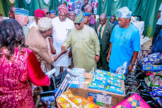 Governor of Osun State, Ademola Adeleke, distributes support materials to people with special needs in the State