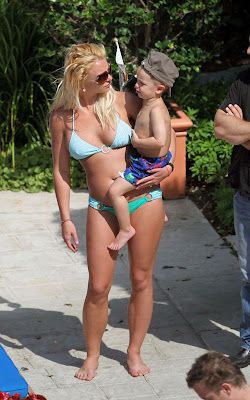 Enjoy the pictures of Britney Spears out by the pool with her kiddies