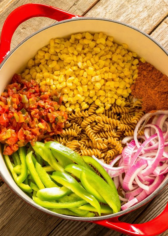 One Pot Wonder Southwest Pasta - Dinner in under 30 minutes in one pot! Pasta, black beans, corn, and bell peppers are spiced up with Rotel and taco seasoning. It's an easy vegetarian meal.