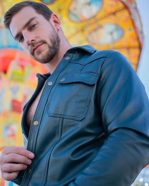 Standing Superior view a brown-haired model wearing a blue leather shirt with buttons