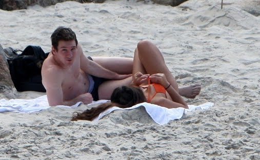 messi girlfriend in beach. on a each and a barbecue