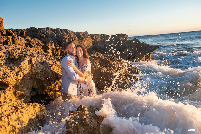 Waves splashing engagement photography in Oahu.