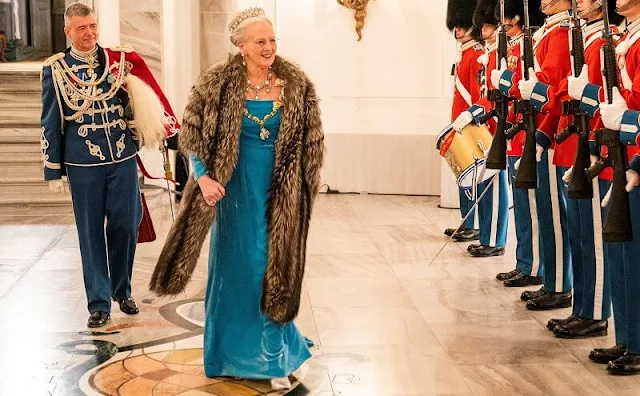 Crown Princess Mary wore a grey gown by Lasse Spangenberg. Princess Benedikte wore a red gown