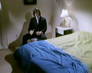 Jimmy Hughes in a scene from the 1973 adult film THE EXPERIMENT