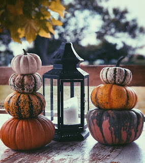 mutlple stacks of colourful pumpkins