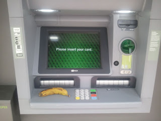 Banana sitting on ATM maching