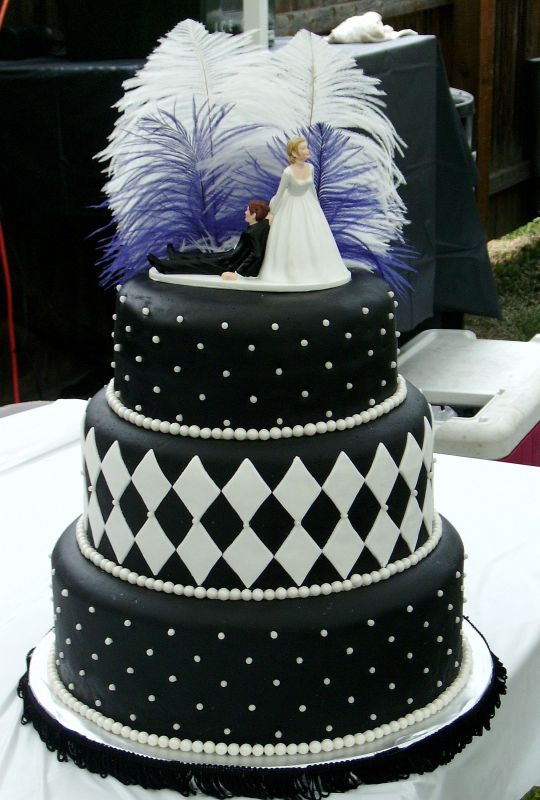 Simple black and white wedding cake with stripes dots and diamonds
