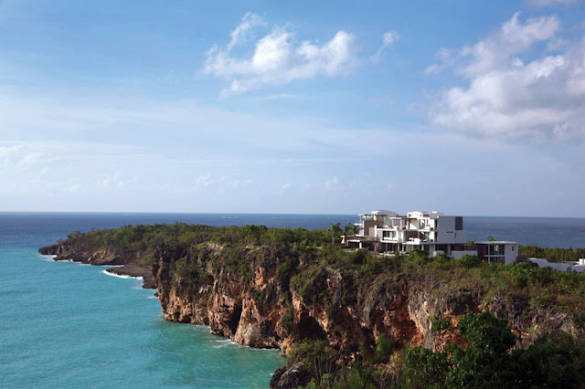 Two modern villas on a cliff overlooking the ocean