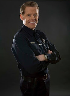 Picture of Doyle Devereux in a police dress