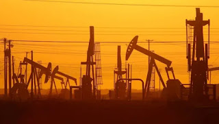 Pump jacks are seen at dawn in an oil field over the Monterey Shale formation in California in 2014. (Credit: David McNew/Getty Images) Click to Enlarge.