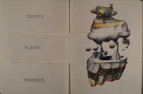 An open book. The lefthand page shows the text "Tricky Plastic Monster" and the right shows a rocky, striped creature. 