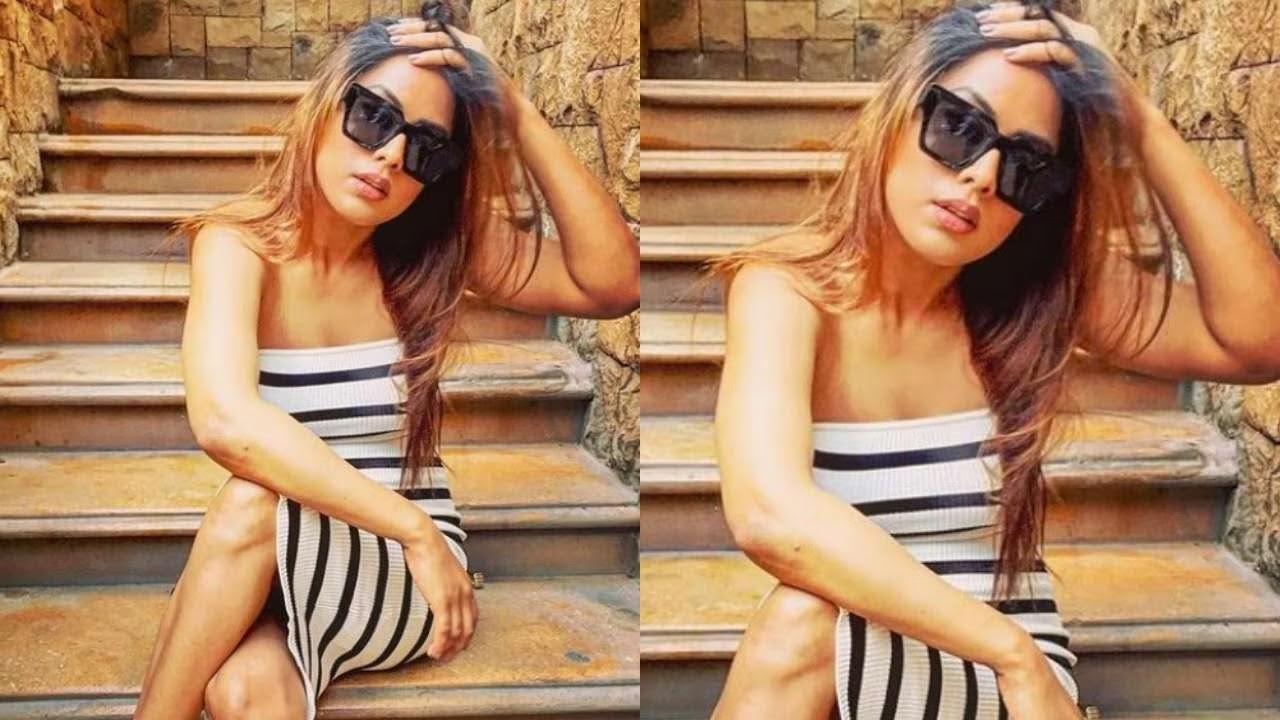 see-viral-photographs-of-nia-sharma-showing-off-her-hourglass-form-in-a-sizzling-striped-bodycon-dress