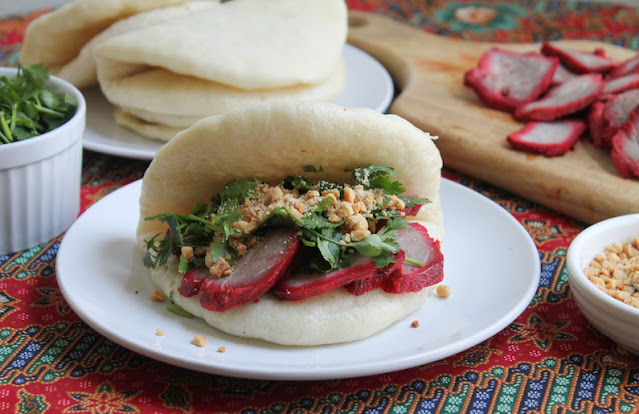 Food Lust People Love: Tiger Biting Pig Buns are soft, steamed bread filled with slices of rich char siu pork, fresh cilantro and roasted peanuts with a little sugar. Each bite is more delectable than the next!