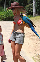 Denise Richards On Vacation In Maui In Her Bikini And Playing With Rental Birds