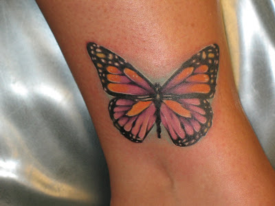 closeup picture of pink lingerie girl with butterfly tattoo