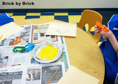 Painting with cookie cutters (Brick by Brick)