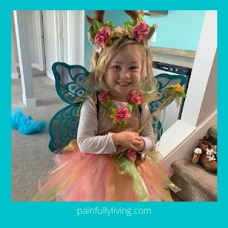 Blond haired young girl wearing fairy costume