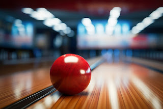 How is a perfect game achieved in bowling?