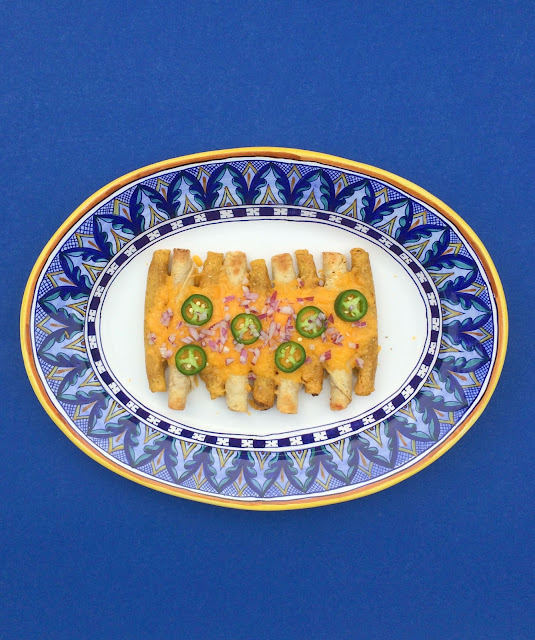 Taquito Recipe - a cheesy, delicious combination of Taquitos and Nachos | www.jacolynmurphy.com