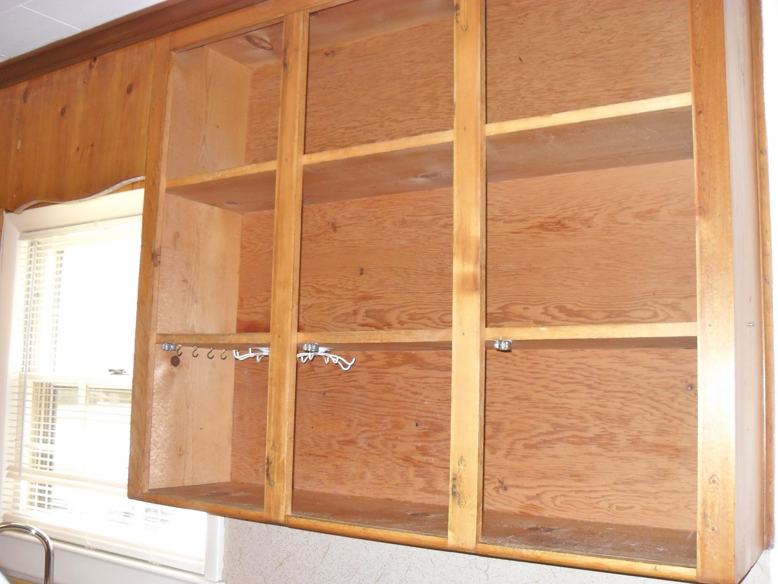 The Remodeled Life DIY Painting Knotty Pine Cabinets