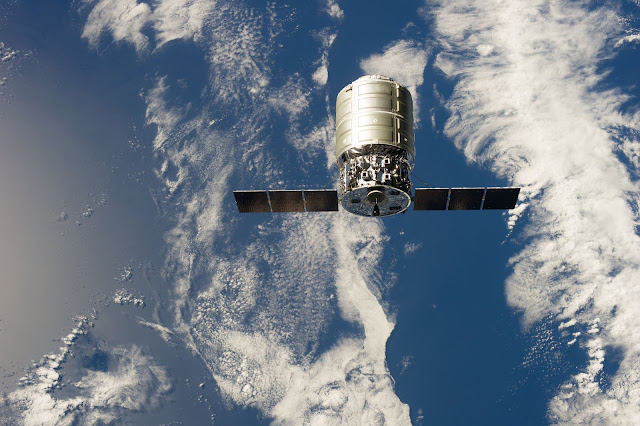 Earth and Cygnus spacecraft seen from International Space Station