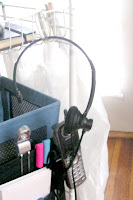 GTDmobile with telephone headset hanging by a shower curtain ring