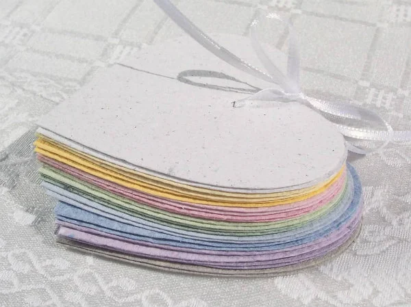 stack of pastel handmade hearts tied together with slim satin ribbon