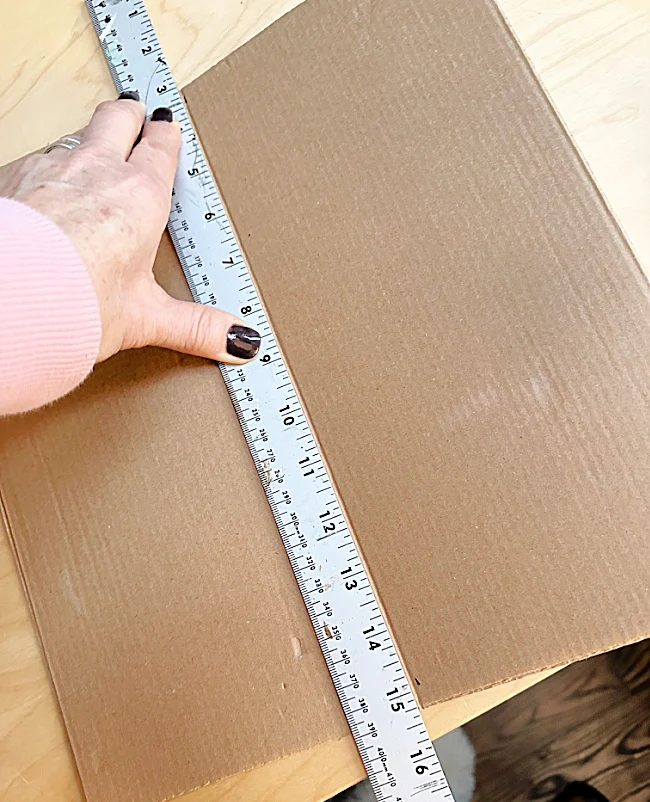 folding cardboard with a ruler