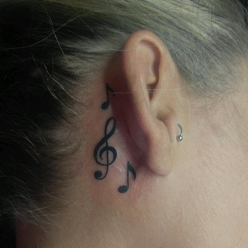 Musical Tattoo beside Ears