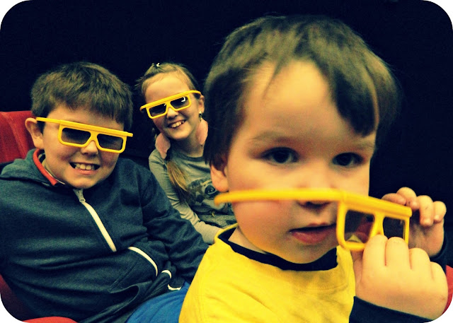Kids Children wearing 3D glasses cinema film