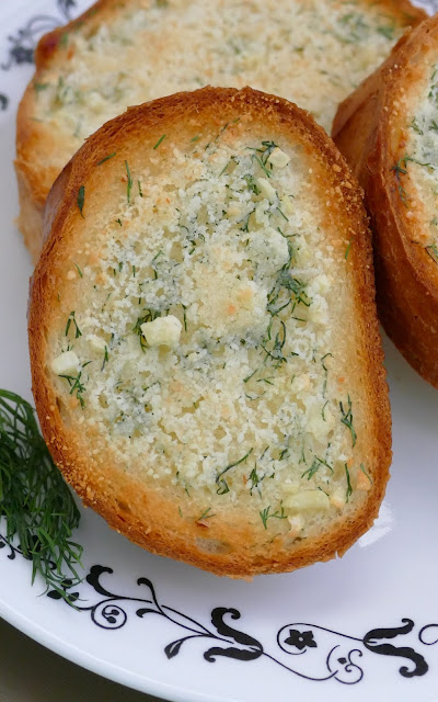 This delicious garlic bread is such a great addition to any meal. The grated parmesan cheese and fresh dill adds a unique pop of flavor to the buttery french bread slices! Easy and ready in less than 15 minutes!