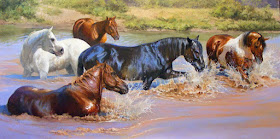 estampida de caballos en el agua