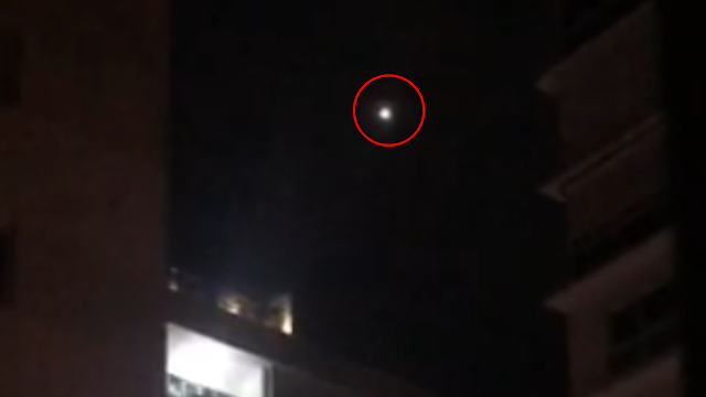 Santo Domingo, Dominican Republic UFO Orb sighting filmed from a balcony in the night sky.