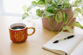 Notebook by a pot plant