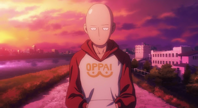 Bohater One Punch-Man ubrany w bluzę Oppai idzie drogą przy rzece