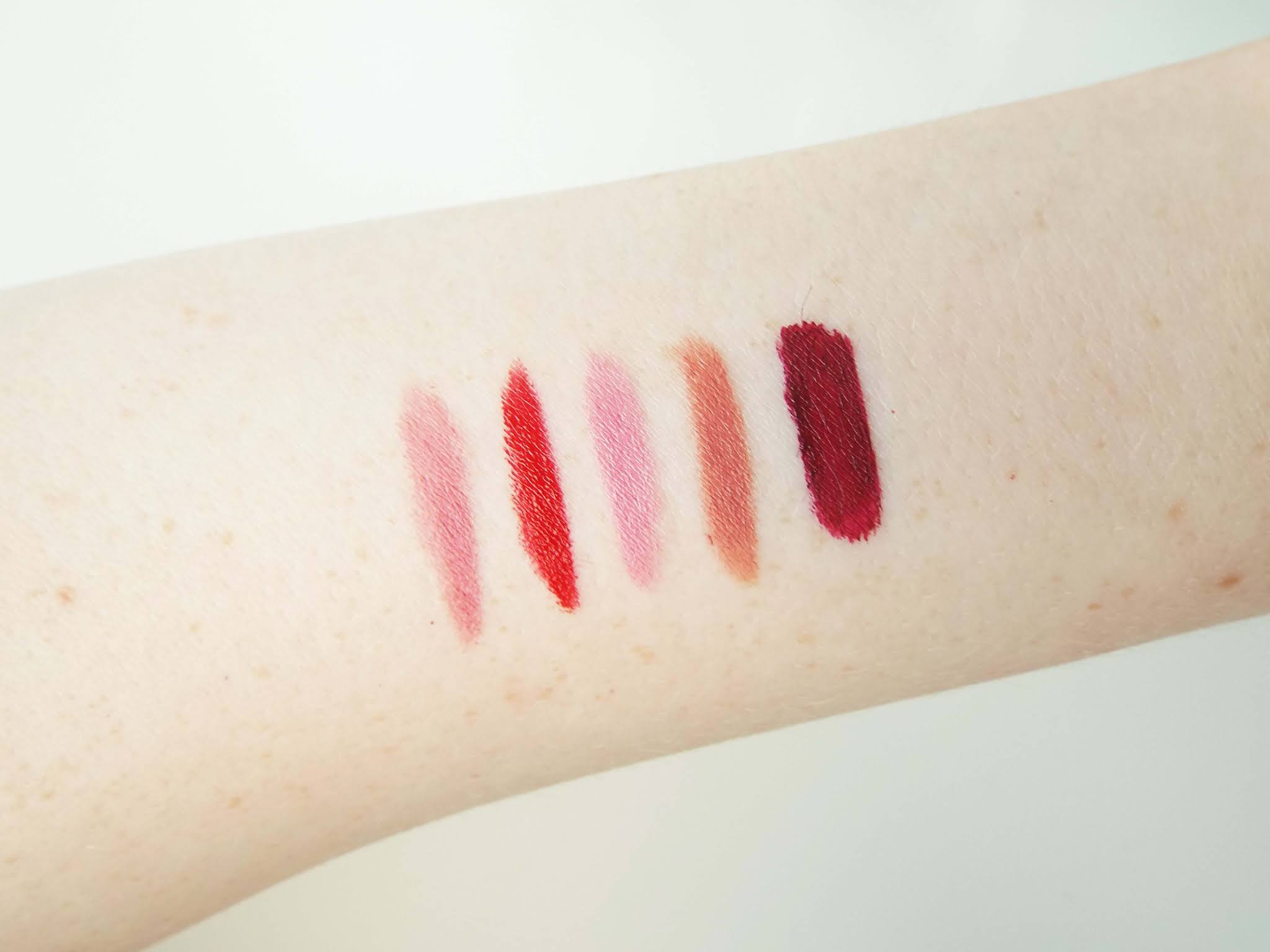 Fives swatches of the Autumnal lip picks discussed, with the Kiko Velvet Passion, Rimmel Kate Moss, MAC and Huda Beauty lipsticks showing from left to right.